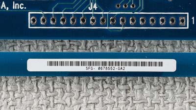 A barcode and id label on a circuit board.